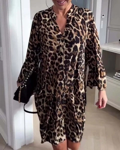 Detail of leopard print maxi dress featuring V-neckline and elegant ruffle hemline
