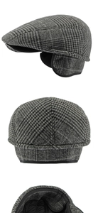 Close-up of grey plaid newsboy cap with ear protection and quilted warm lining