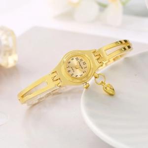 Elegant gold bracelet watch for women featuring a heart pendant and white inlay accents