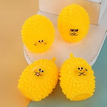 Set of four yellow durian-shaped squeeze toys with various cute facial expressions