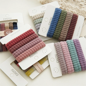 Detail of multi-color seamless elastic hair ties with ribbed fabric texture and stretch