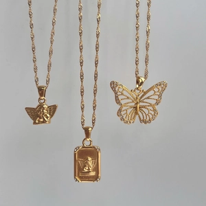 Three gold stainless steel necklaces with angel, cherub square, and butterfly pendants