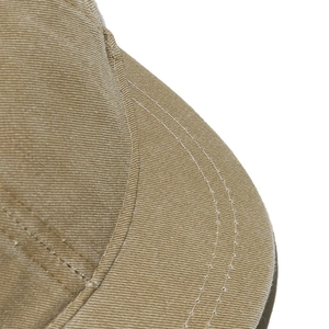 Close-up of khaki twill cotton baseball cap with reinforced stitching and fine texture