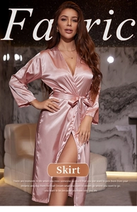 Detailed view of pink satin long-sleeved bathrobe with V-neck and elegant waist tie