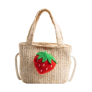 Kids woven straw handbag in beige featuring a cute plush strawberry design on the front