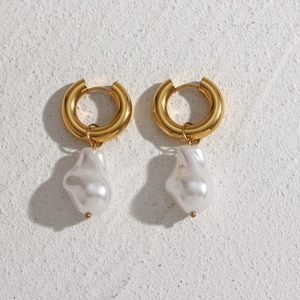 Detail of 18K gold-plated stainless steel hoop earrings with baroque pearls on stone