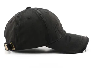 Side view of a vintage distressed black baseball cap with retro metal adjustment buckle