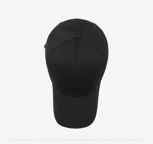 Top view of black cotton baseball cap featuring white polar bear embroidery detail