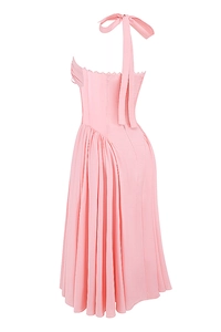 Detail of pink halter neck corset dress showing pleated skirt and silk texture