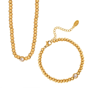 Golden round bead necklace and bracelet jewelry set with inlaid circular crystal stones