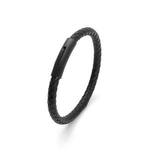 Close-up of black braided leather bracelet featuring a secure magnetic metal clasp