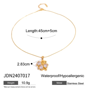 Detailed view of gold clover necklace with size parameters and stainless steel specs