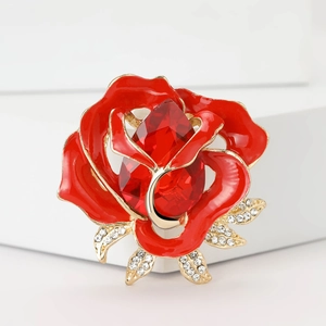 Elegant red enamel rose brooch with gold-tone metal, red gemstone and clear rhinestones