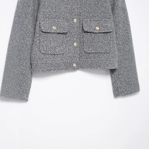 Short grey tweed jacket for women featuring golden embossed buttons and dual pockets