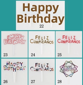 Detailed view of assorted Happy Birthday cake toppers in gold and vibrant multi-color designs