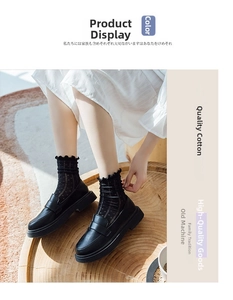 Detail of black polka dot mesh socks with ruffled cuffs paired with matte leather loafers