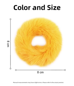 Detail view of a soft plush yellow scrunchie featuring 8cm diameter and fluffy texture