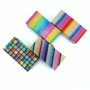 Detailed view of four colorful rainbow crystal clutch bags with sparkling rhinestone patterns