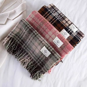 Set of three soft plaid scarves with tassels in rose pink, grey-green and brown colors