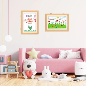 Close-up of wooden kids art frame with front-opening design in a cozy nursery setting