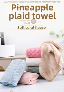 Soft coral fleece towels with pineapple grid texture shown in various pastel colors.