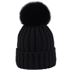 Women's black knit beanie with large pompom decoration and thick fleece lining