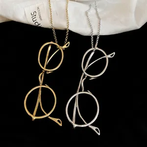 Minimalist eye-shaped pendant necklace in gold and silver finish with slim chain