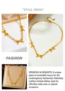 Detailed views of gold butterfly pendant on stainless steel curb chain with toggle