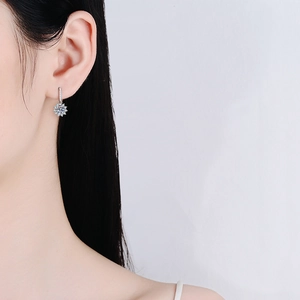 Classic S925 sterling silver sunflower moissanite earrings on female model
