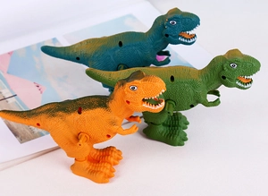 Detailed view of three plastic wind-up dinosaur toys with textured skin and wind-up knobs