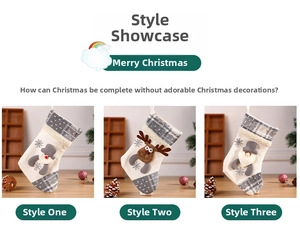 Detail of three gray and white knit Christmas stockings with Santa, snowman and reindeer