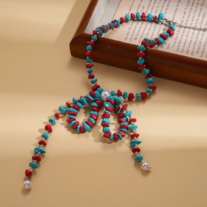 Bohemian sweater necklace with irregular turquoise stones, pearls and bow accents