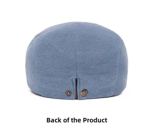 Detailed back view of blue corduroy beret hat with adjustable double metal buttons