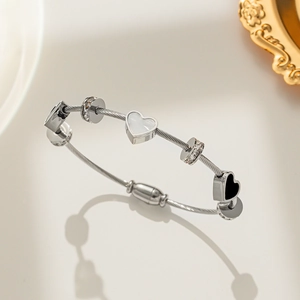 Titanium steel wire rope bracelet with double heart charms and zircon inlays