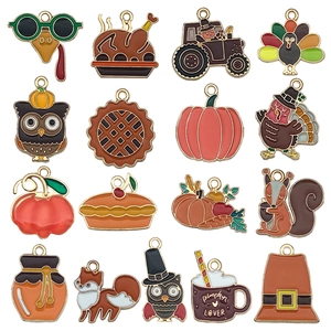 Assorted Thanksgiving charms including pumpkins and turkeys for DIY jewelry making