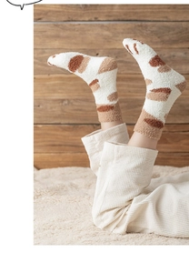 Close-up of cozy cat claw coral fleece socks showing soft texture and cute paw design
