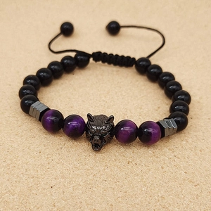 Detailed view of adjustable beaded bracelet with black wolf head charm and purple beads