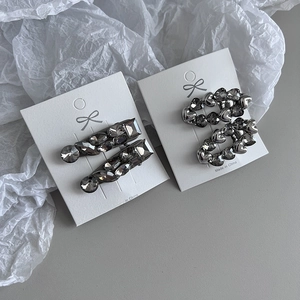 Metallic silver rhinestone hair clip set with rectangle and heart designs on display card