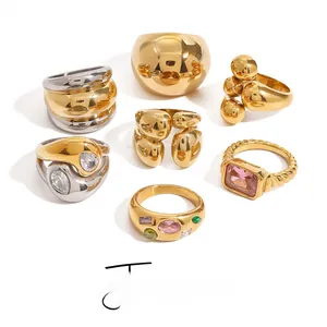 Collection of gold and silver rings with cubic zirconia and colorful gemstones