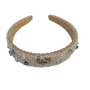 Elegant wide pearl headband with gold base and sparkling star rhinestone accents