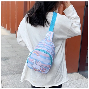 Detail of cute pink and blue striped unicorn chest bag with adjustable blue strap on girl