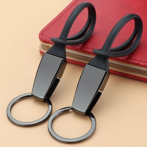 Minimalist black titanium car keychain set with metal ring and matte silicone strap