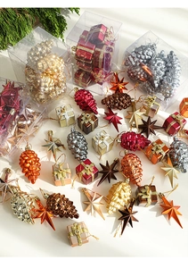 Close-up of colorful electroplated Christmas tree ornaments in various festive shapes