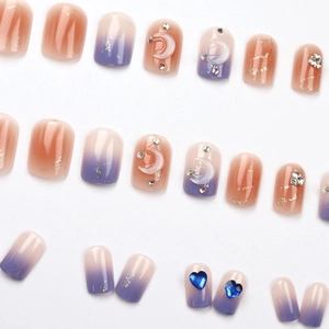 Star and moon press-on nails with mocha gradient, heart rhinestones, and 3D relief