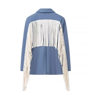 Detail view of the back of a blue wool blazer featuring long white decorative tassels