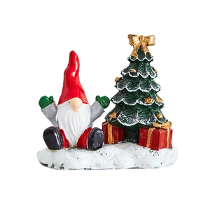 Christmas gnome with red hat and decorated green tree festive holiday decoration