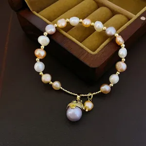 Baroque freshwater pearl bracelet with multicolor beads and purple pendant on luxury box