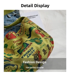 Detail of green canvas tote with retro cartoon prints, metal buttons, and stitching