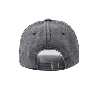 Detail view of washed grey denim baseball cap with adjustable bronze metal buckle back