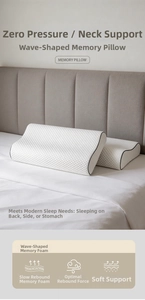 Macro shot of white memory foam pillows with diamond quilted fabric and black piping edge